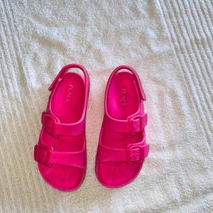 Children place buckle sandals